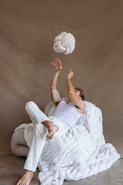 Creamy Cloud Fur Blanket with Male Model by Lola Blankets