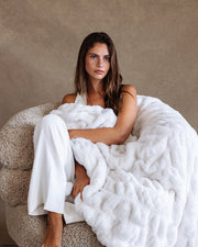 Creamy Cloud Fur Blanket with Female Model by Lola Blankets