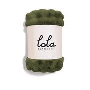 Green blanket with 'lola blankets' label on a white background