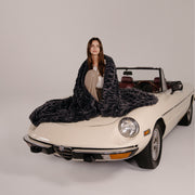 Charcoal Grey Faux Fur Blanket on Car with Female Model