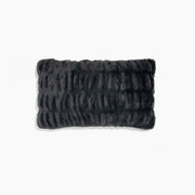 Textured black rectangular pillow on a white background