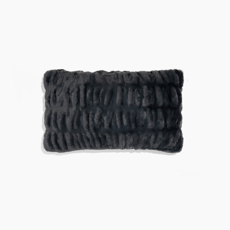 Textured black rectangular pillow on a white background