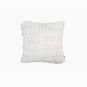 White textured pillow on a white background