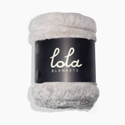 Gray fleece blanket with 'lola blankets' label on a white background