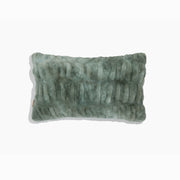 Textured green pillow on a white background