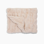 Beige textured blanket on a white background