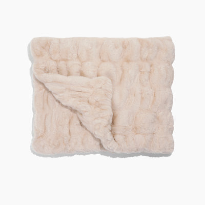 Beige textured blanket on a white background