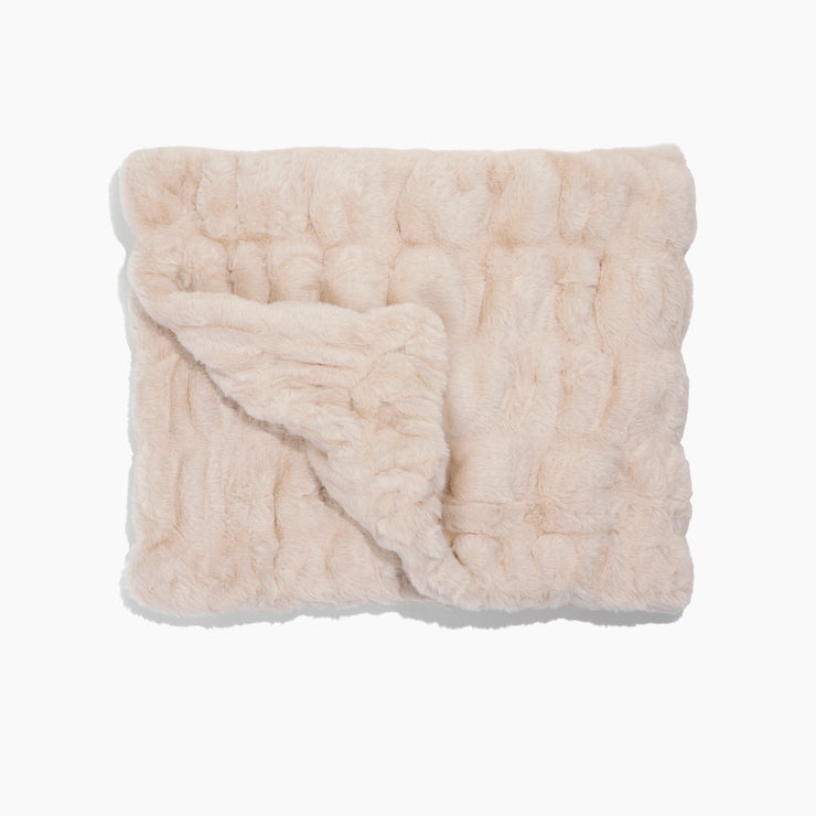 Beige textured blanket on a white background