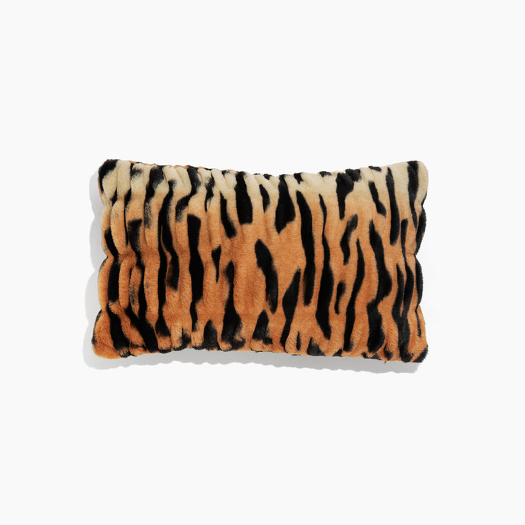 Tiger-striped pillow on a white background