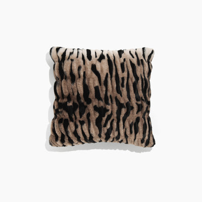 Pillow with tiger stripe pattern on a white background