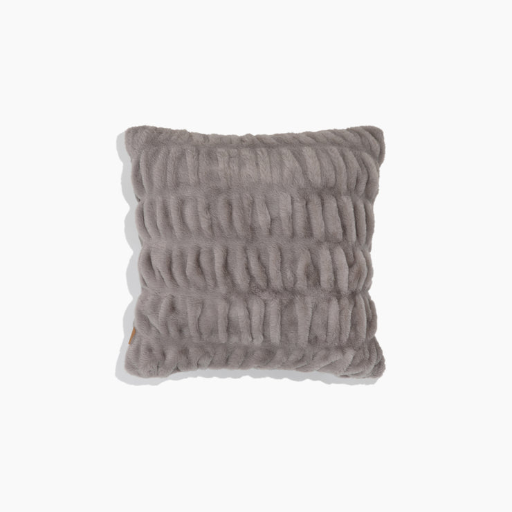 Textured gray pillow on a white background