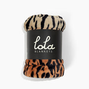 Animal print blanket on a white background wrapped up