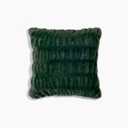 Green textured pillow on a white background