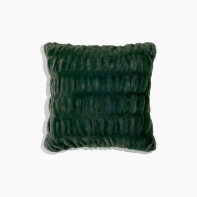 Green textured pillow on a white background