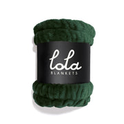 Dark green blanket with 'lola blankets' branding on a white background